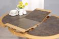 Table ronde Contemporaine Romain, diamtre 120 cm ralise en chne avec un pieds central et 1 allonge portefeuille de 50 cm Cramique IRONGREY 